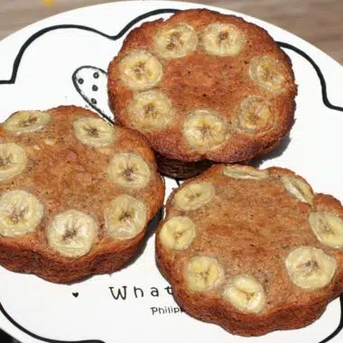 round banana bread loaves on a white plate