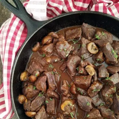 Beef Pot Roast with Mushrooms and Gravy in a Cast Iron Skillet