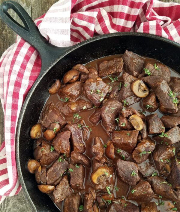 Beef Pot Roast with Mushrooms and Gravy in a Cast Iron Skillet