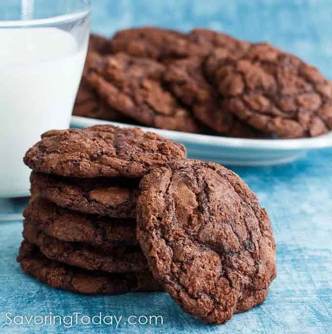 A stack of Brownie cookies with milk