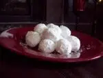 Russian tea cakes on a red plalte