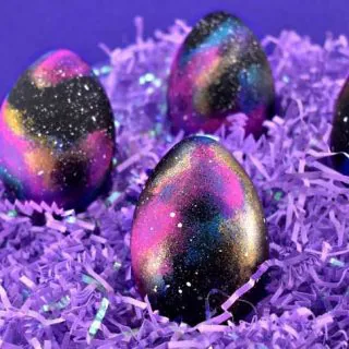 Easter eggs painted to look like the galaxy.