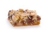Cookie bar with chocolate chips, coconut, walnuts on a graham cracker crust.