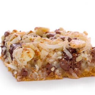 Cookie bar with chocolate chips, coconut, walnuts on a graham cracker crust.