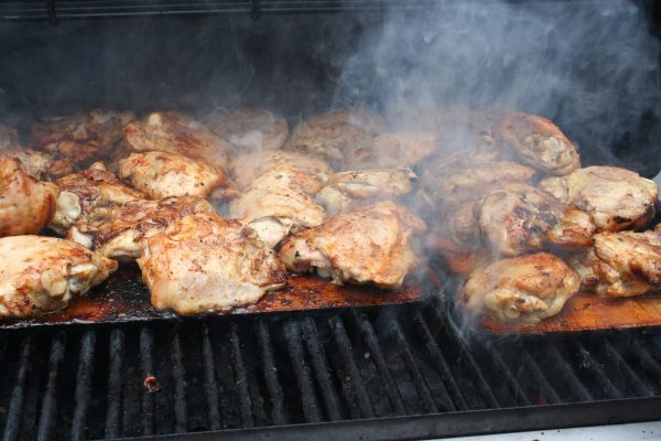 Using cedar planks to smoke chicken on the grill.