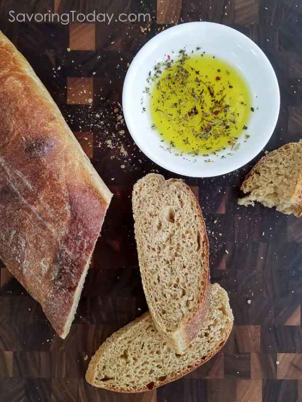 Sprouted Wheat French Bread sliced to serve with olive oil and herbs.