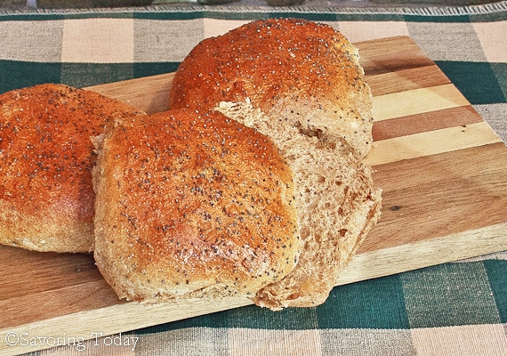 Caramelized Onion Burger Bun sliced on a cutting board.