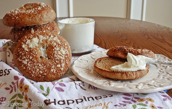 Healthy wholesome sprouted wheat bagels baked with a Parmesan cheese topping and crust.