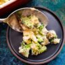 Broccoli Cauliflower Gratin served on a black ceramic plate.