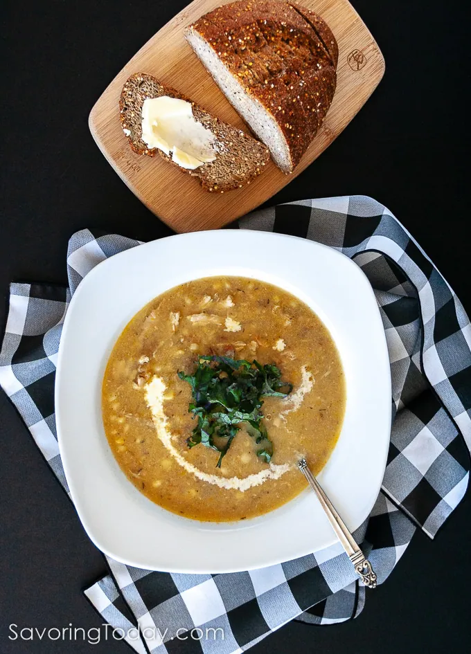 Chicken & Corn Chowder Recipe in a white bowl on a black background.