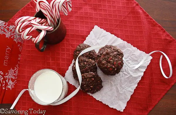 Peppermint Chip Chocolate Cookies on a red napkin with milk