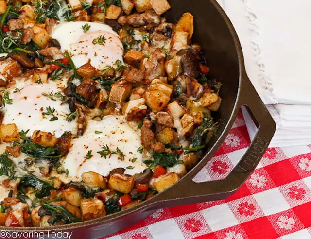Savory Breakfast Skillet with sweet potatoes, vegetables and sunny eggs is a hearty, healthy breakfast for brunch .