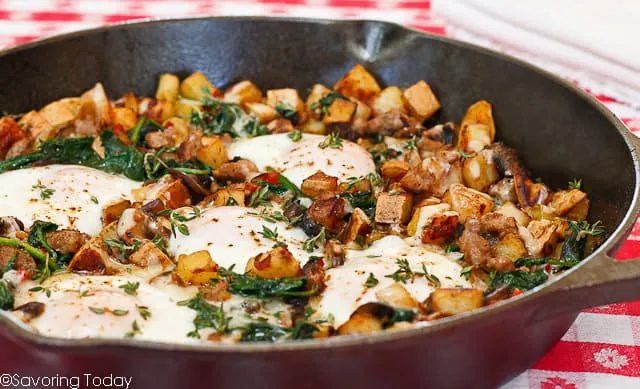 Savory Breakfast Skillet with Sweet Potatoes, Sausage, Spinach and Sunny Eggs is a delicious one-skillet meal.
