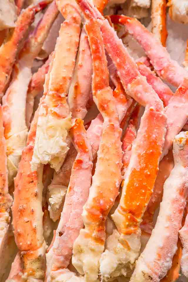 Frozen Crab Legs in a straight pile.