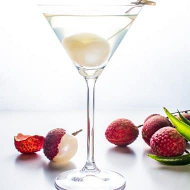 A martini with lychee fruit.