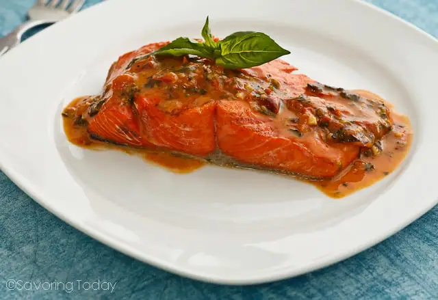 Grilled Wild Salmon served with Tomato-Basil Butter Sauce, made from compound butter and white wine. Get the best 5 grilling tips for fish or salmon.