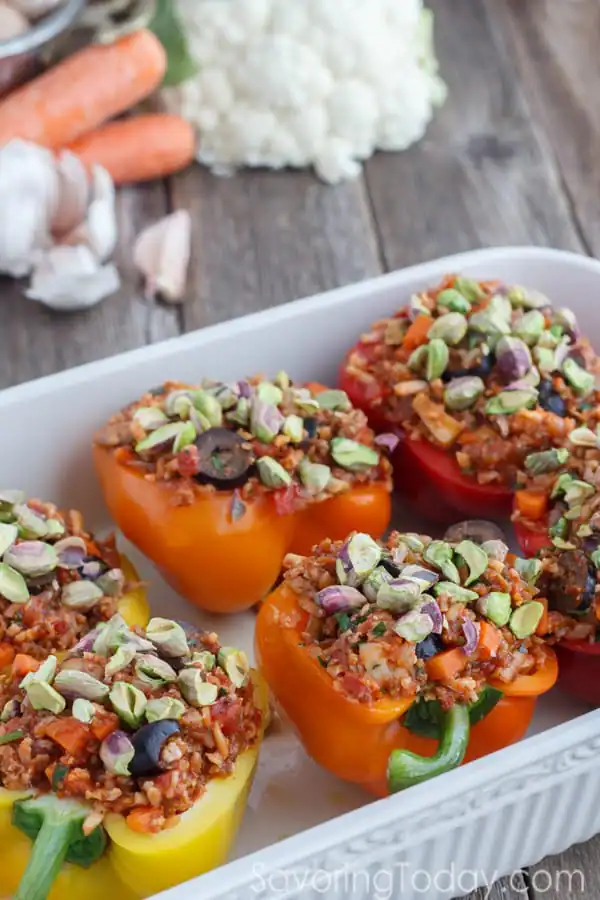 Paleo Sausage & Cauliflower Rice Stuffed Bell Pepper Recipe with Caramelized Onion and Pistachio Topping