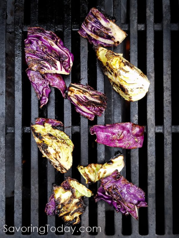 Green and purple cabbage create a beautiful side dish from the grill. Topped with classic Caesar dressing and crushed croutons, it is sure to become your new favorite from the grill.
