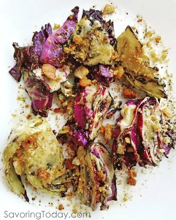 Grilled Caesar Cabbage will impress all summer long with its charred edges and savory classic Caesar flavor. Top with crushed croutons and a spray of parmesan for the best summer side dish from the grill.