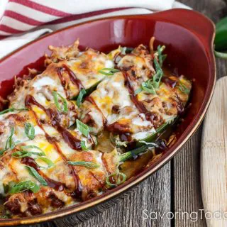 Jalapenos stuffed with BBQ pulled pork and topped with cheese for an amazingly easy and delicious appetizer.