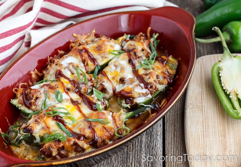 Jalapenos stuffed with BBQ pulled pork and topped with cheese are an amazingly easy and delicious appetizer recipe.