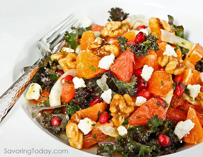 Orange and grapefruit citrus salad with kale, walnuts and pomegranate served with Orange-Dijon Dressing.