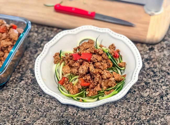 Turkey on top of zucchini noodles for a quick meal. Follow these 3 steps to weekly meal prep!
