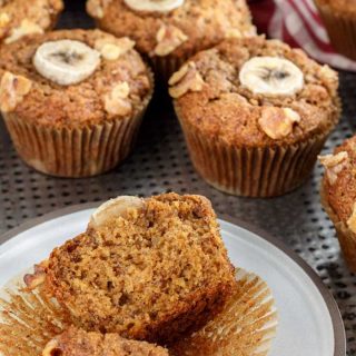 Banana muffins made with sprouted whole wheat, served on a white plate