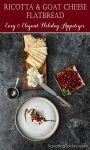Cheese and cracker appetizer with pomegranate seeds.