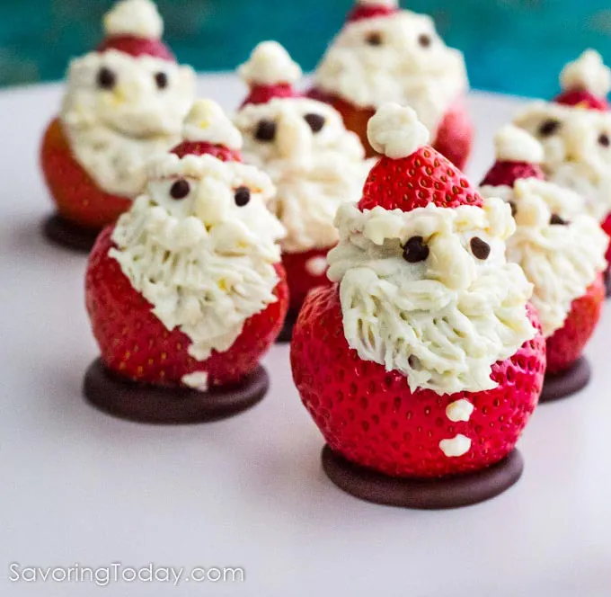 Strawberries with cheesecake filling decorated to look like Santa Claus