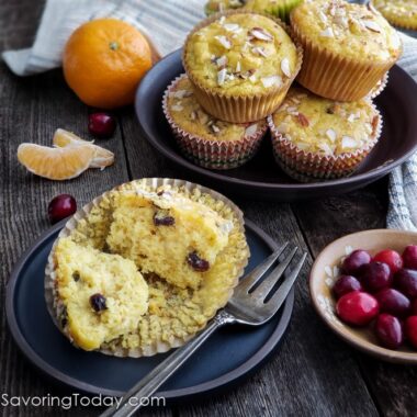 Cranberry Orange muffin on a blue plate with a fork.