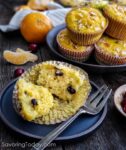 Cranberry Orange Muffin on a dark blue plate with a fork