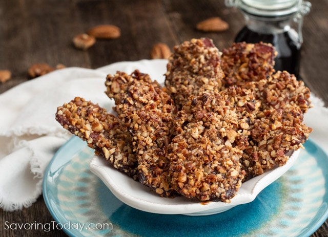 Strips of bacon covered in chopped pecans and candied with maple syrup.