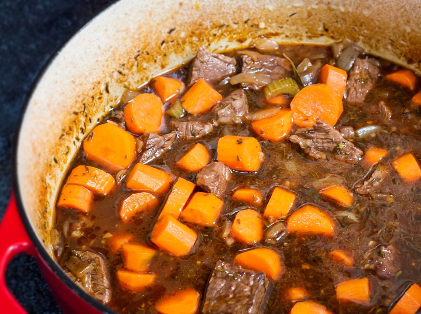 Carrots floating in an Irish Beef Stew.