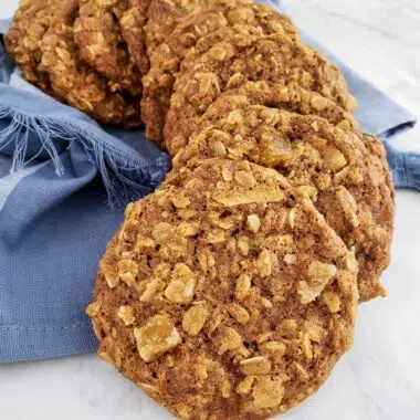 Ginger Oatmeal Cookies Stacked High on a Blue Towel