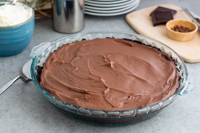 A whole chocolate cream pie fresh from the fridge after its set