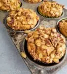 Pumpkin pie spice muffins in a tin from the oven.