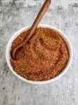 homemade chili seasoning in a white bowl with a spoon