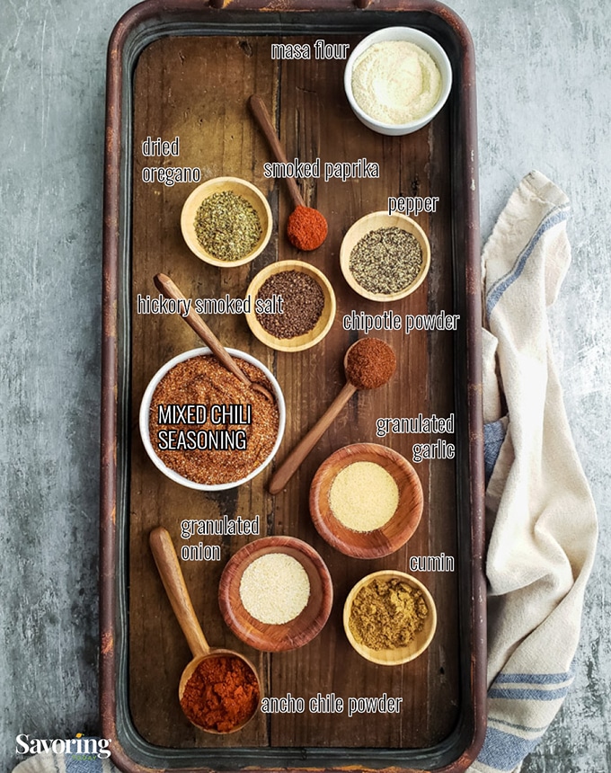 Individual chili seasoning ingredients on a serving tray