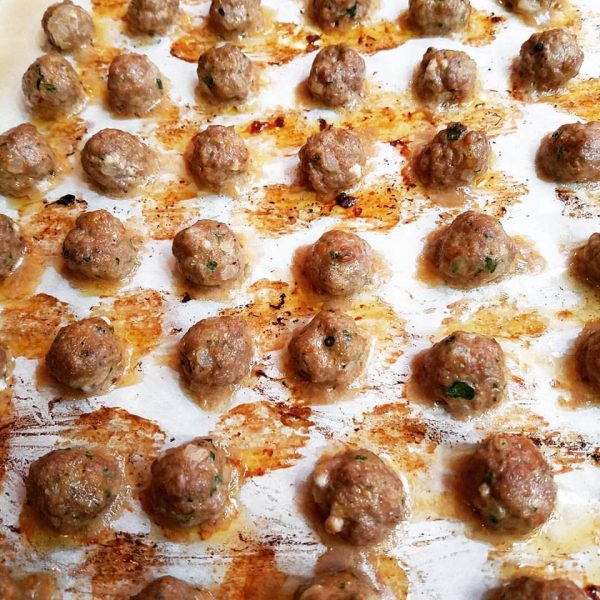Roasted meatballs on a sheet pan