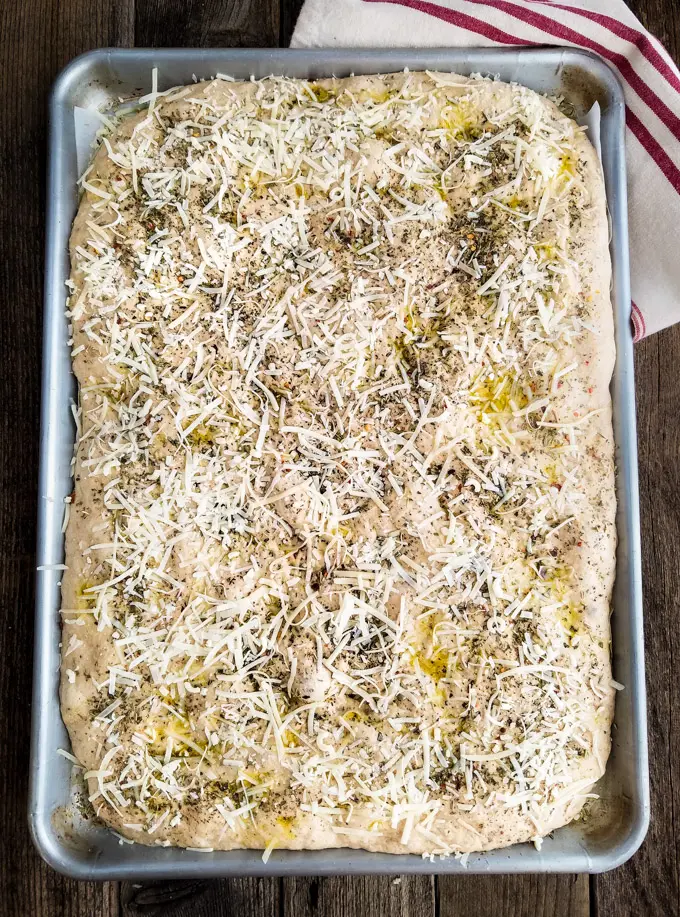focaccia bread topped with parmesan and dried herbs
