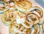 grilled onions on a tin tray
