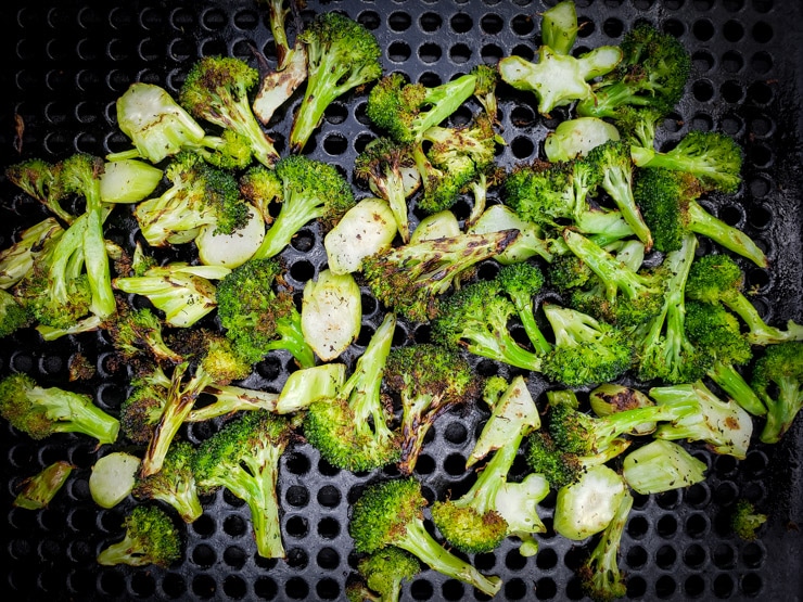 grilled broccoli browning on the grill pan