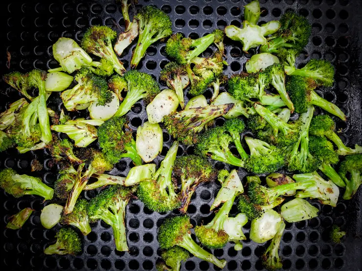 grilled broccoli browning on the grill pan