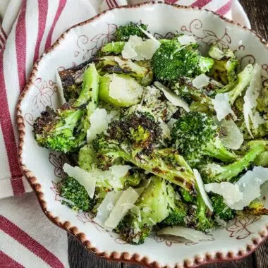 grilled broccoli with parmesan in a bowl