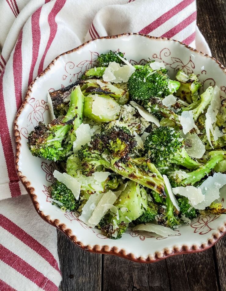 grilled broccoli with parmesan in a bowl