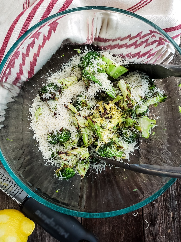 tossing grilled broccoli with lemon zest and parmesan
