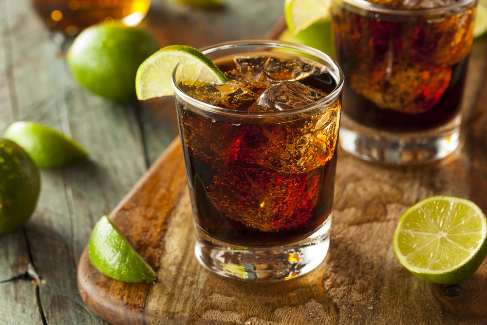 Dark Rum cocktail with lime and ice