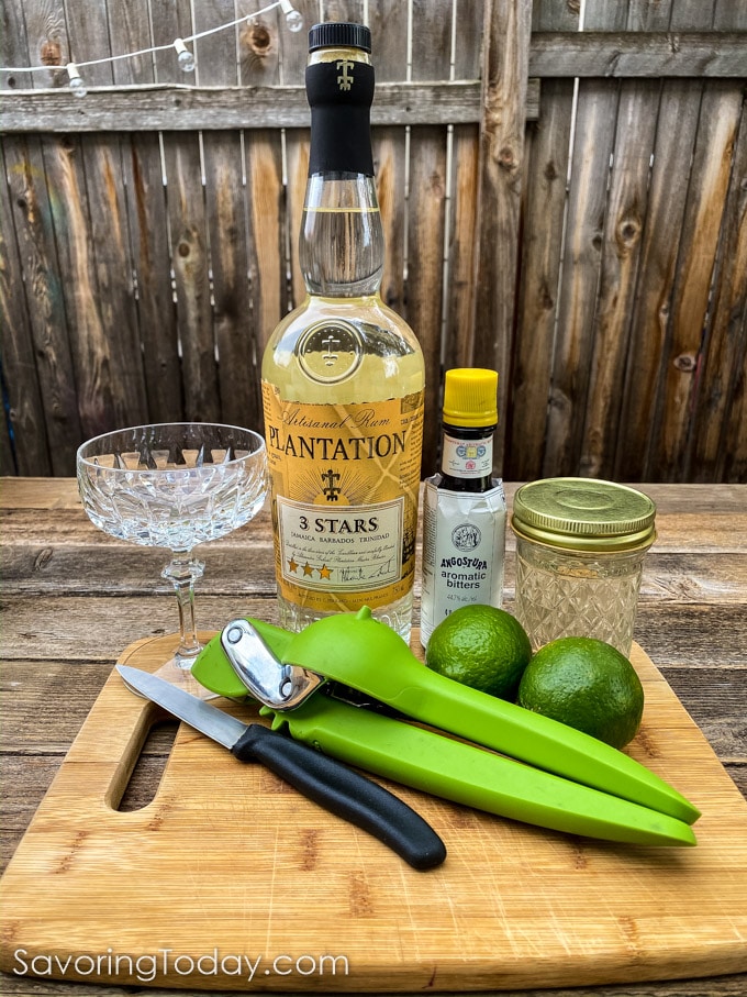 Bar tools and ingredients for a rum cocktail