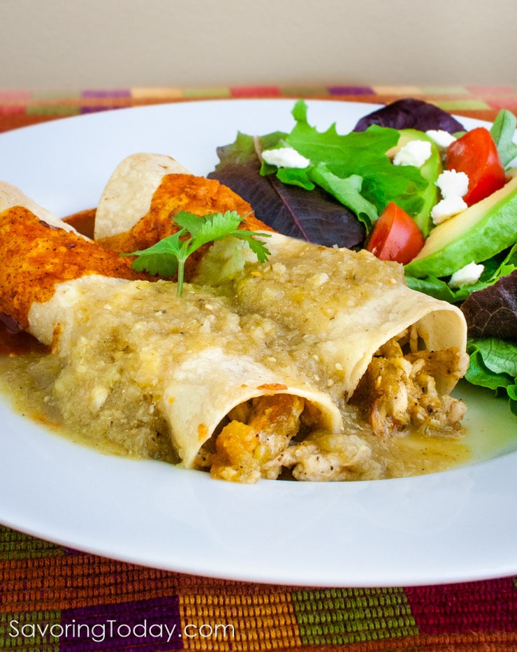 red and green enchilada sauce over chicken enchiladas on a white plate